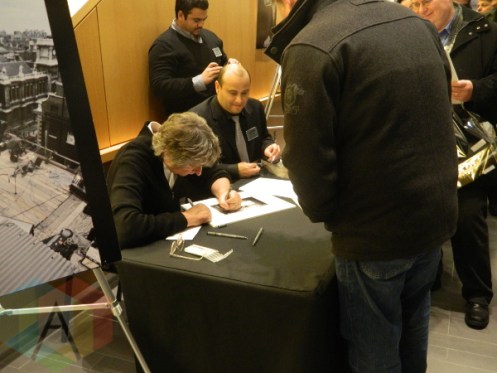 Ethan Russell signs a photo for a fan at his "Best Seat in the House" show at the Richmond Hill Centre for the Performing Arts on March 1st. (Photo: Sarah Munn/Aesthetic Magazine Toronto)