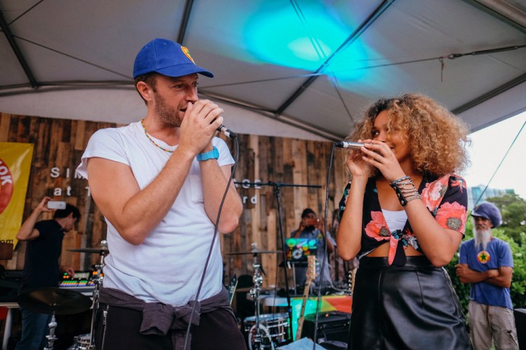 Chris Martin of Coldplay and Izzy Bizu perform at The Wynwood Yard in Miami, Florida on August 27, 2017. (Photo: Andrea Lorena)